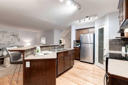 120 New Brighton Lane Se, Calgary, AB - Indoor Photo Showing Kitchen With Double Sink