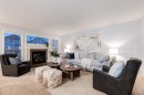 120 New Brighton Lane Se, Calgary, AB  - Indoor Photo Showing Living Room With Fireplace 