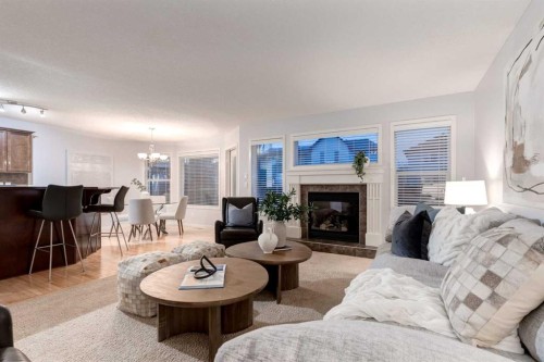 120 New Brighton Lane Se, Calgary, AB - Indoor Photo Showing Living Room With Fireplace