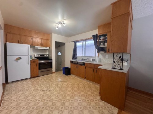 2521 35 Street Se, Calgary, AB - Indoor Photo Showing Kitchen With Double Sink