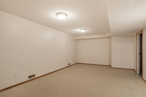 716 Coach Bluff Crescent Sw, Calgary, AB - Indoor Photo Showing Other Room