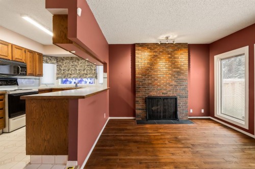 716 Coach Bluff Crescent Sw, Calgary, AB - Indoor With Fireplace