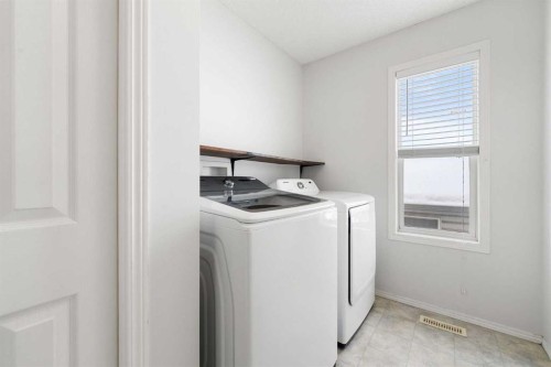 283 Prestwick Landing Se, Calgary, AB - Indoor Photo Showing Laundry Room