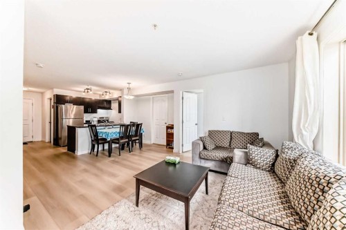 211-355 Taralake Way Ne, Calgary, AB - Indoor Photo Showing Living Room