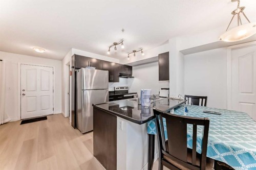 211-355 Taralake Way Ne, Calgary, AB - Indoor Photo Showing Kitchen With Double Sink
