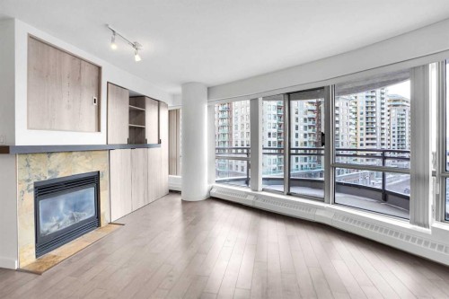 705-1088 6 Avenue Sw, Calgary, AB - Indoor Photo Showing Living Room With Fireplace