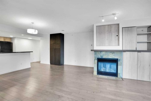 705-1088 6 Avenue Sw, Calgary, AB - Indoor With Fireplace