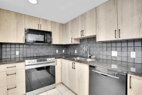 705-1088 6 Avenue Sw, Calgary, AB - Indoor Photo Showing Kitchen With Upgraded Kitchen