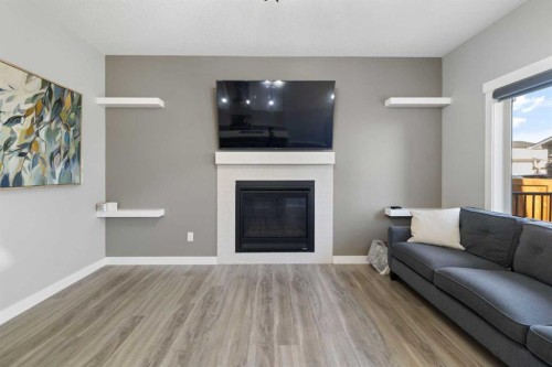 628 Edgefield Street, Strathmore, AB - Indoor Photo Showing Living Room With Fireplace