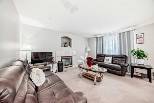 270 Covewood Circle Ne, Calgary, AB - Indoor Photo Showing Living Room With Fireplace