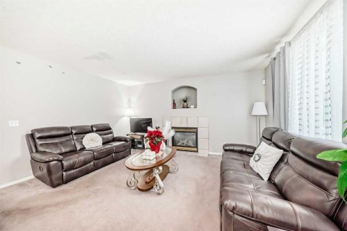 270 Covewood Circle Ne, Calgary, AB - Indoor Photo Showing Living Room With Fireplace