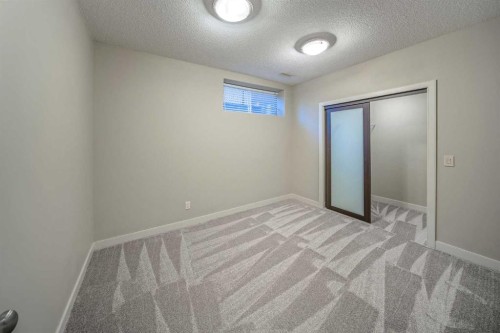 74 Sherwood Point Nw, Calgary, AB - Indoor Photo Showing Other Room