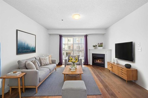 1211-279 Copperpond Common Se, Calgary, AB - Indoor Photo Showing Living Room With Fireplace