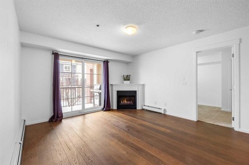 1211-279 Copperpond Common Se, Calgary, AB - Indoor Photo Showing Living Room With Fireplace