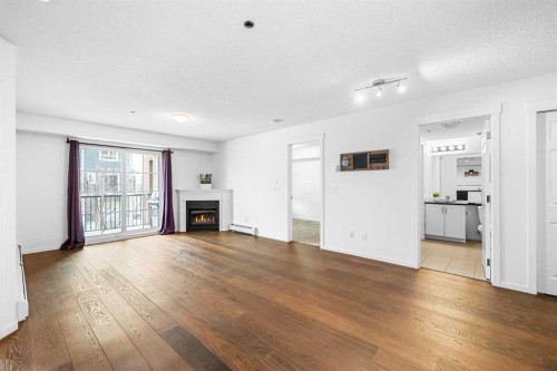 1211-279 Copperpond Common Se, Calgary, AB - Indoor Photo Showing Living Room With Fireplace