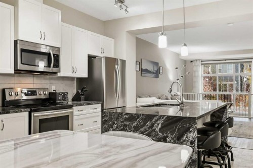 143 Masters Link Se, Calgary, AB - Indoor Photo Showing Kitchen With Stainless Steel Kitchen With Upgraded Kitchen