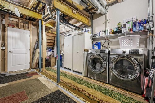 143 Masters Link Se, Calgary, AB - Indoor Photo Showing Laundry Room