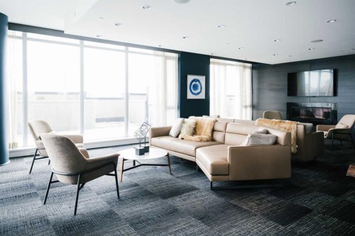 702-1188 3 Street Se, Calgary, AB - Indoor Photo Showing Living Room With Fireplace