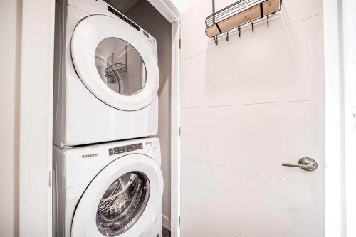 69 Les Jardins Park Se, Calgary, AB - Indoor Photo Showing Laundry Room