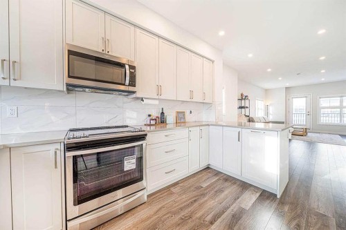 69 Les Jardins Park Se, Calgary, AB - Indoor Photo Showing Kitchen With Stainless Steel Kitchen With Upgraded Kitchen