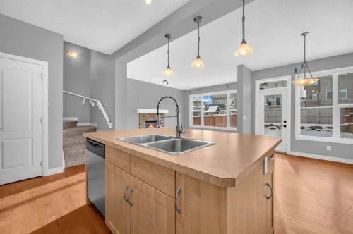 402 Hillcrest Circle Sw, Airdrie, AB - Indoor Photo Showing Kitchen With Double Sink