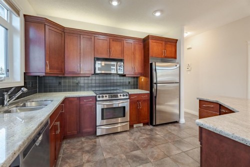 14 Discovery Woods Villas Sw, Calgary, AB - Indoor Photo Showing Kitchen With Double Sink