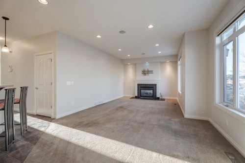 14 Discovery Woods Villas Sw, Calgary, AB - Indoor With Fireplace