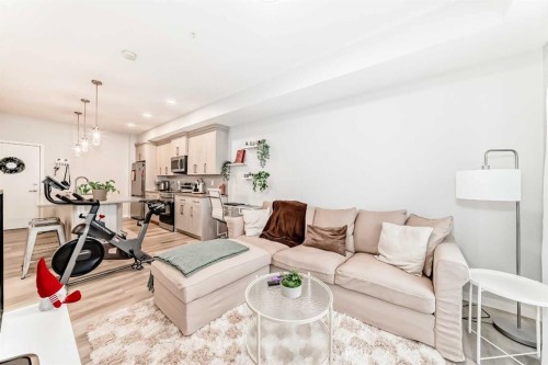 2401-42 Cranbrook Gardens Se, Calgary, AB - Indoor Photo Showing Living Room