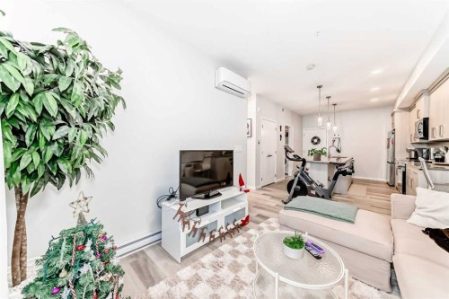 2401-42 Cranbrook Gardens Se, Calgary, AB - Indoor Photo Showing Living Room
