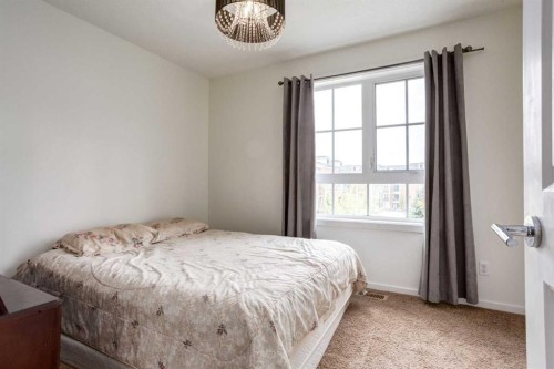 215 Copperpond Common Se, Calgary, AB - Indoor Photo Showing Bedroom