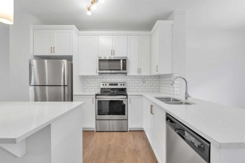 131 Legacy Point Se, Calgary, AB - Indoor Photo Showing Kitchen With Stainless Steel Kitchen With Double Sink With Upgraded Kitchen
