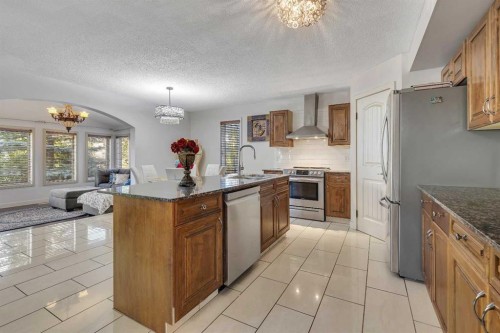 135 Panatella Close Nw, Calgary, AB - Indoor Photo Showing Kitchen With Double Sink