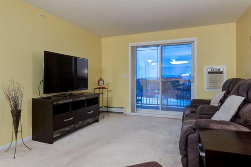406-99 Westview Drive, Nanton, AB - Indoor Photo Showing Living Room