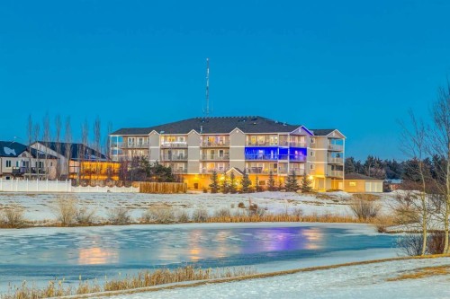 406-99 Westview Drive, Nanton, AB - Outdoor With Body Of Water With View