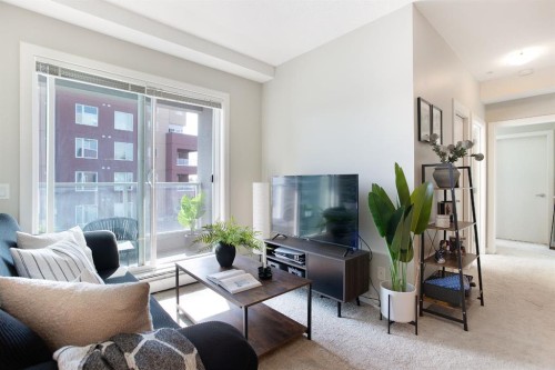 2203-604 East Lake Boulevard Ne, Airdrie, AB - Indoor Photo Showing Living Room