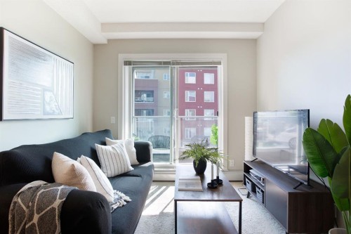 2203-604 East Lake Boulevard Ne, Airdrie, AB - Indoor Photo Showing Living Room