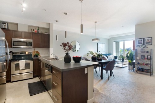 2203-604 East Lake Boulevard Ne, Airdrie, AB - Indoor Photo Showing Kitchen With Double Sink With Upgraded Kitchen