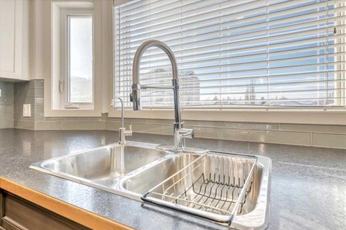 124 Strathcona Circle, Strathmore, AB - Indoor Photo Showing Kitchen With Double Sink