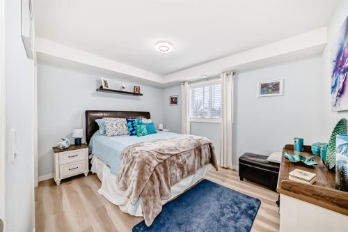 200-8 Bayside Place, Strathmore, AB - Indoor Photo Showing Bedroom