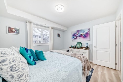 200-8 Bayside Place, Strathmore, AB - Indoor Photo Showing Bedroom