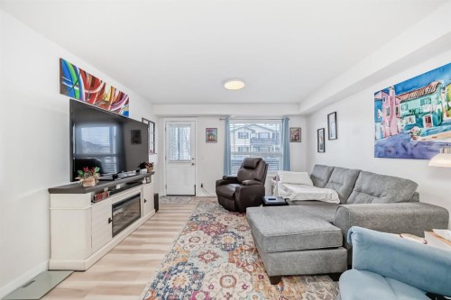 200-8 Bayside Place, Strathmore, AB - Indoor Photo Showing Living Room