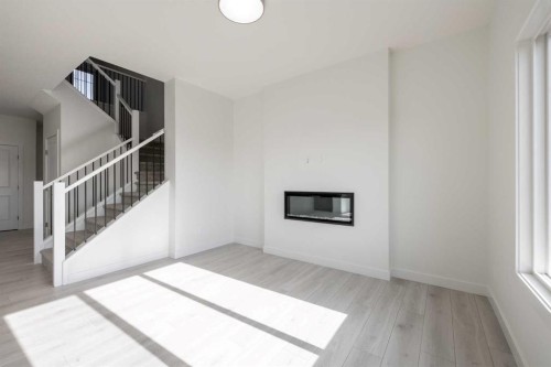89 Sora Gardens Se, Calgary, AB - Indoor Photo Showing Other Room With Fireplace