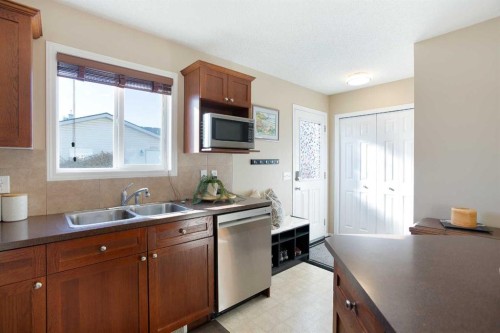 444 Morningside Way Sw, Airdrie, AB - Indoor Photo Showing Kitchen With Double Sink