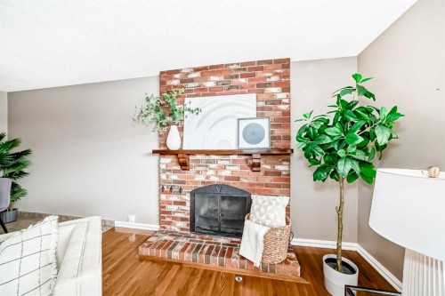 131 Bracewood Road Sw, Calgary, AB - Indoor With Fireplace