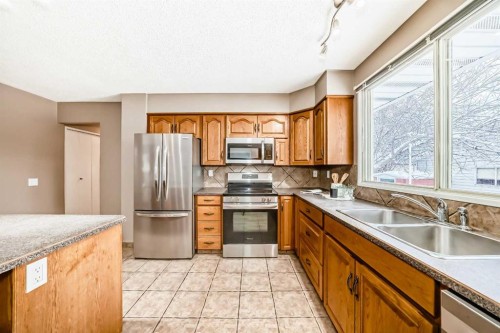 131 Bracewood Road Sw, Calgary, AB - Indoor Photo Showing Kitchen With Double Sink