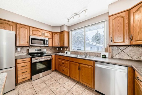 131 Bracewood Road Sw, Calgary, AB - Indoor Photo Showing Kitchen With Stainless Steel Kitchen With Double Sink