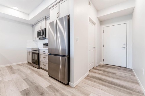 1410-33 Carringham Gate Nw, Calgary, AB - Indoor Photo Showing Kitchen With Stainless Steel Kitchen