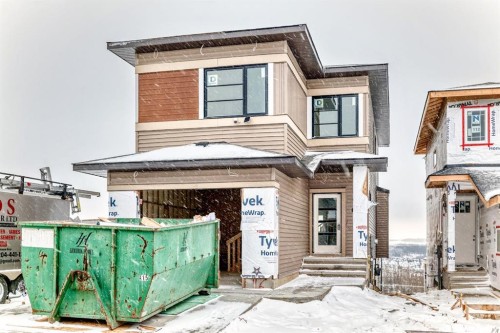 116 Heritage Manor, Cochrane, AB - Outdoor With Facade