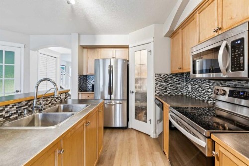 45 Prestwick Rise Se, Calgary, AB - Indoor Photo Showing Kitchen With Stainless Steel Kitchen With Double Sink With Upgraded Kitchen