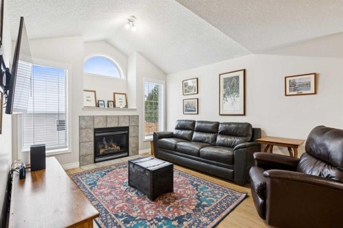 45 Prestwick Rise Se, Calgary, AB - Indoor Photo Showing Living Room With Fireplace